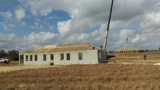 crane lifting roof trusses